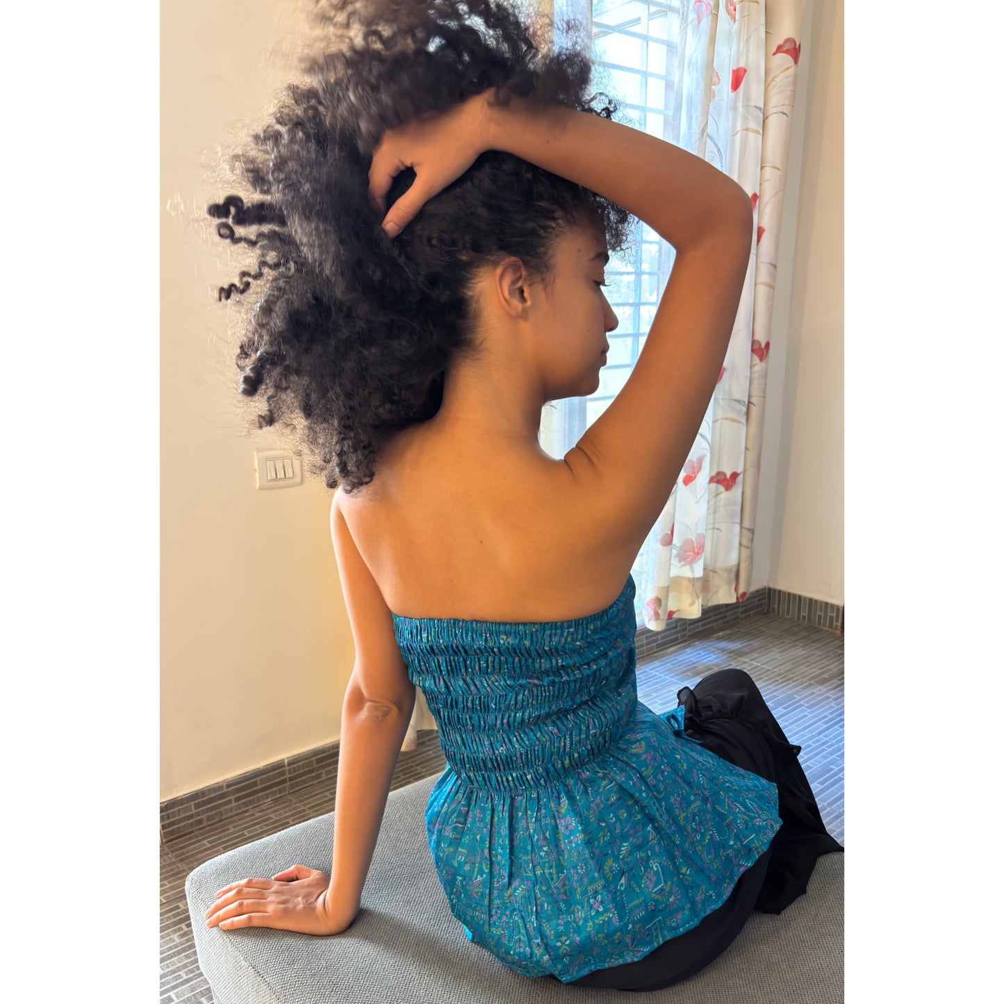Artsy blue smocked back top