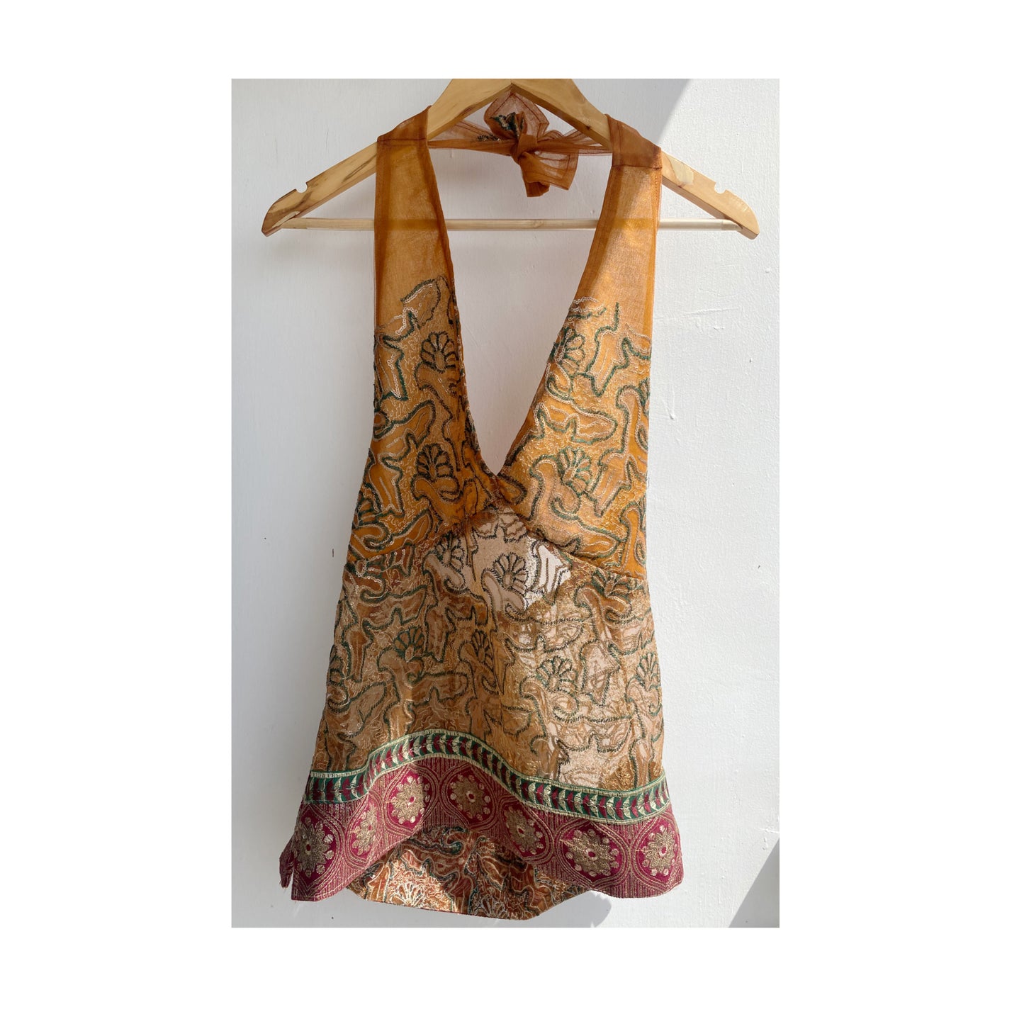 Golden brown with embroidery and red border