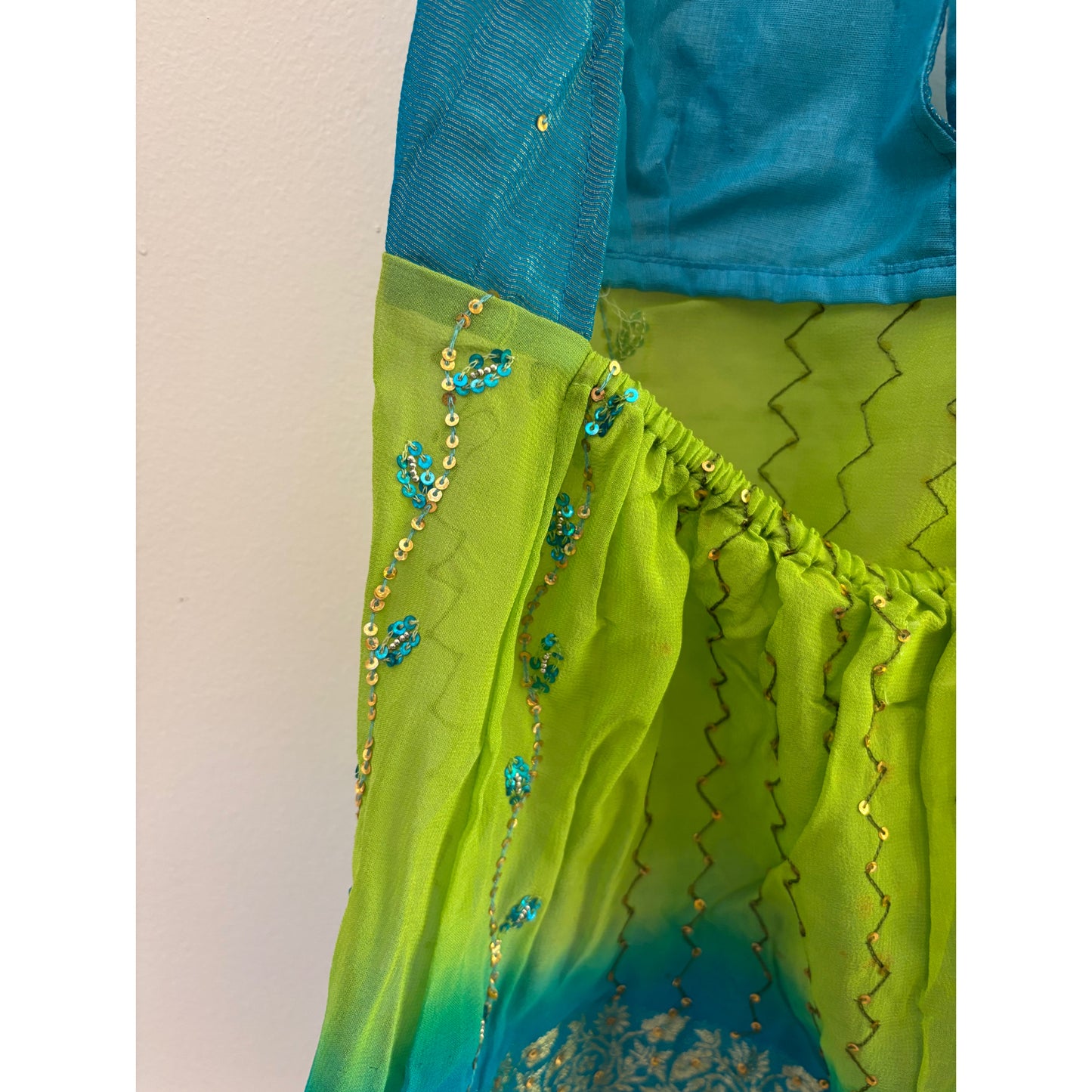 Blue green handwork top with floral border