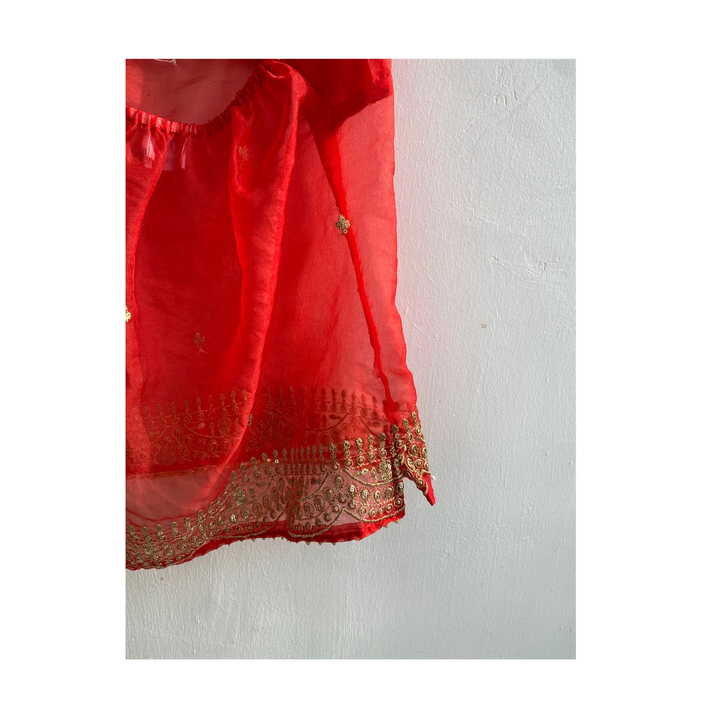 Red with golden work halter neck