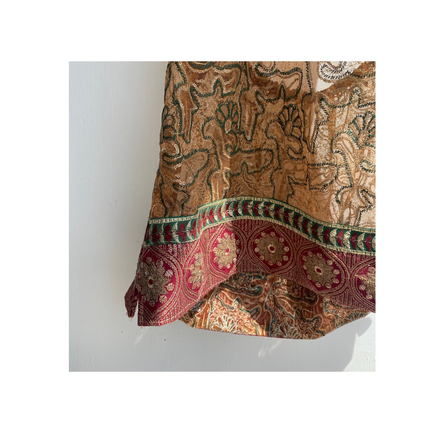 Golden brown with embroidery and red border
