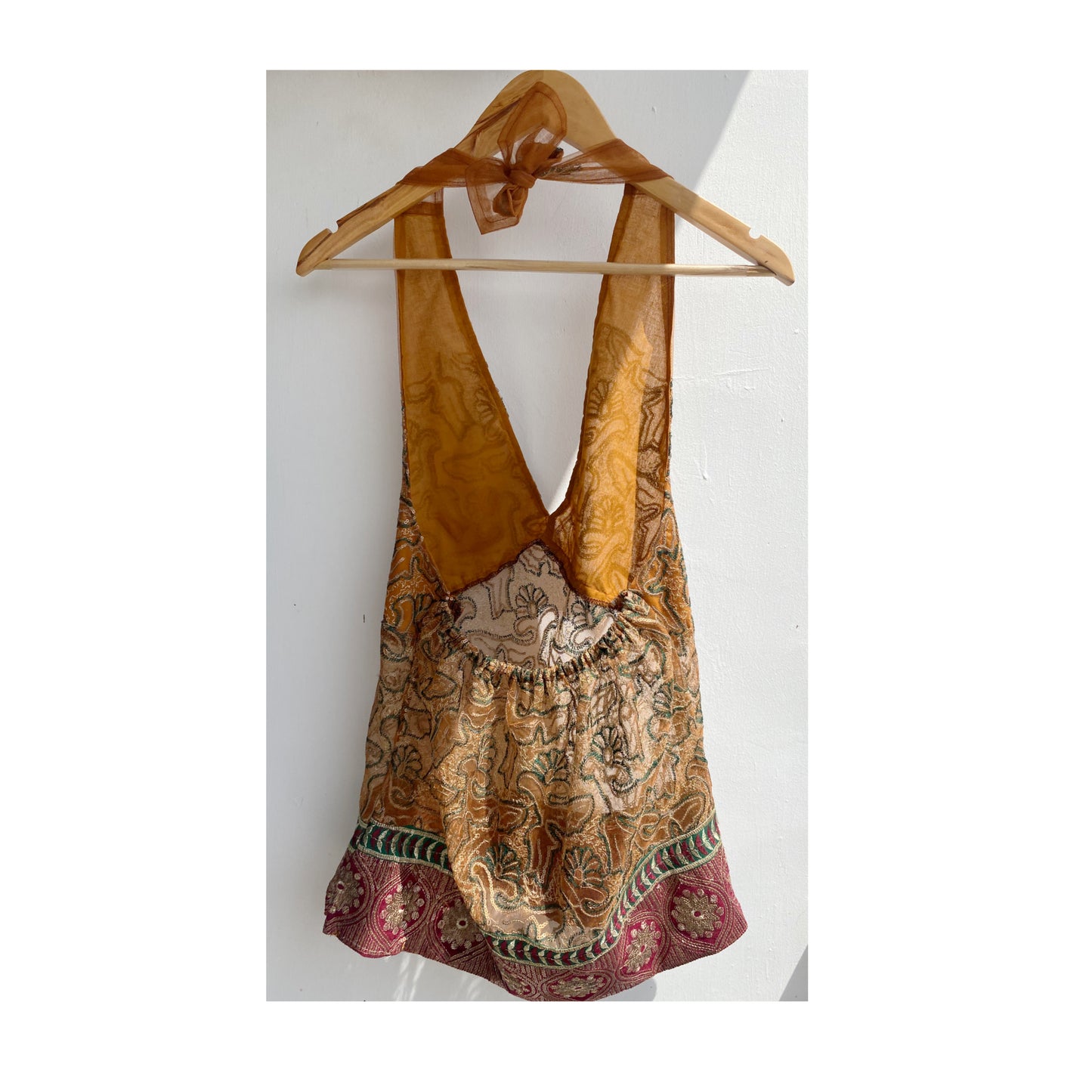 Golden brown with embroidery and red border