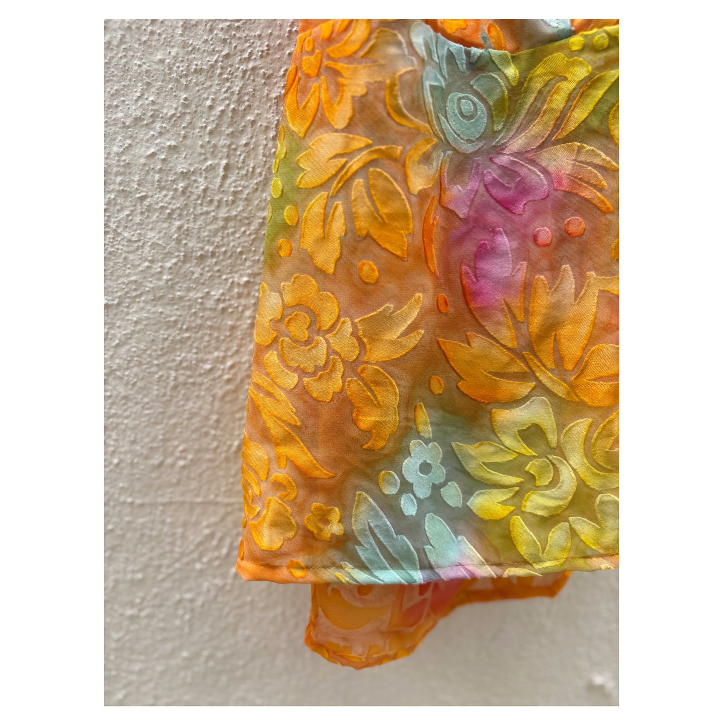 Orange floral textured top