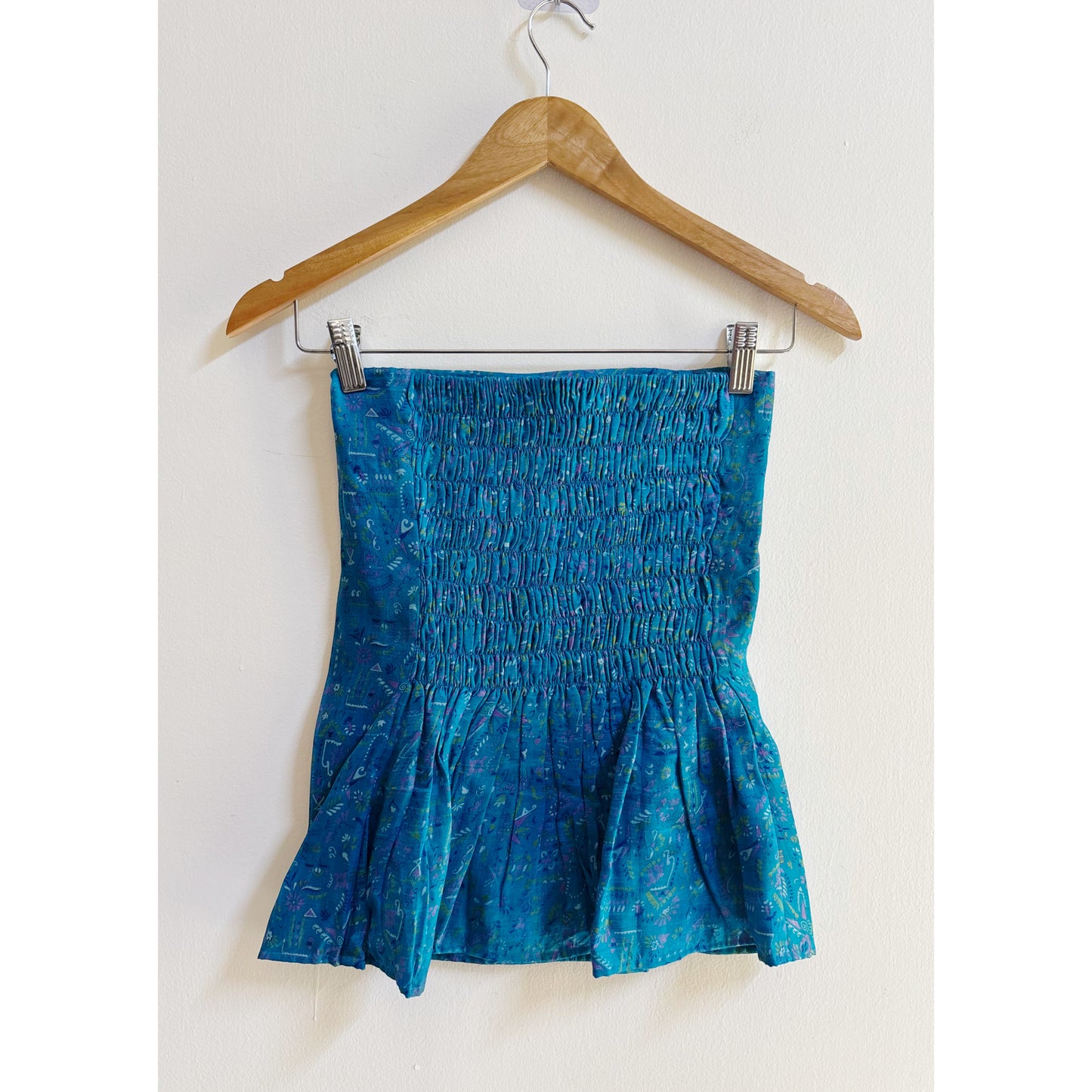 Artsy blue smocked back top