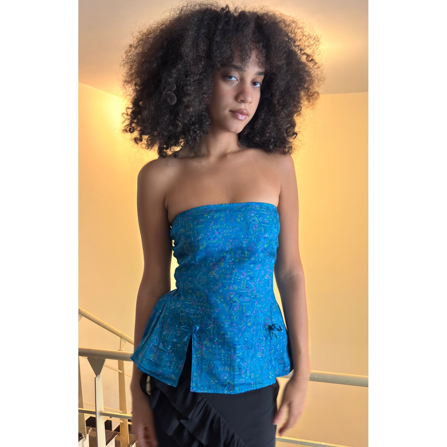 Artsy blue smocked back top