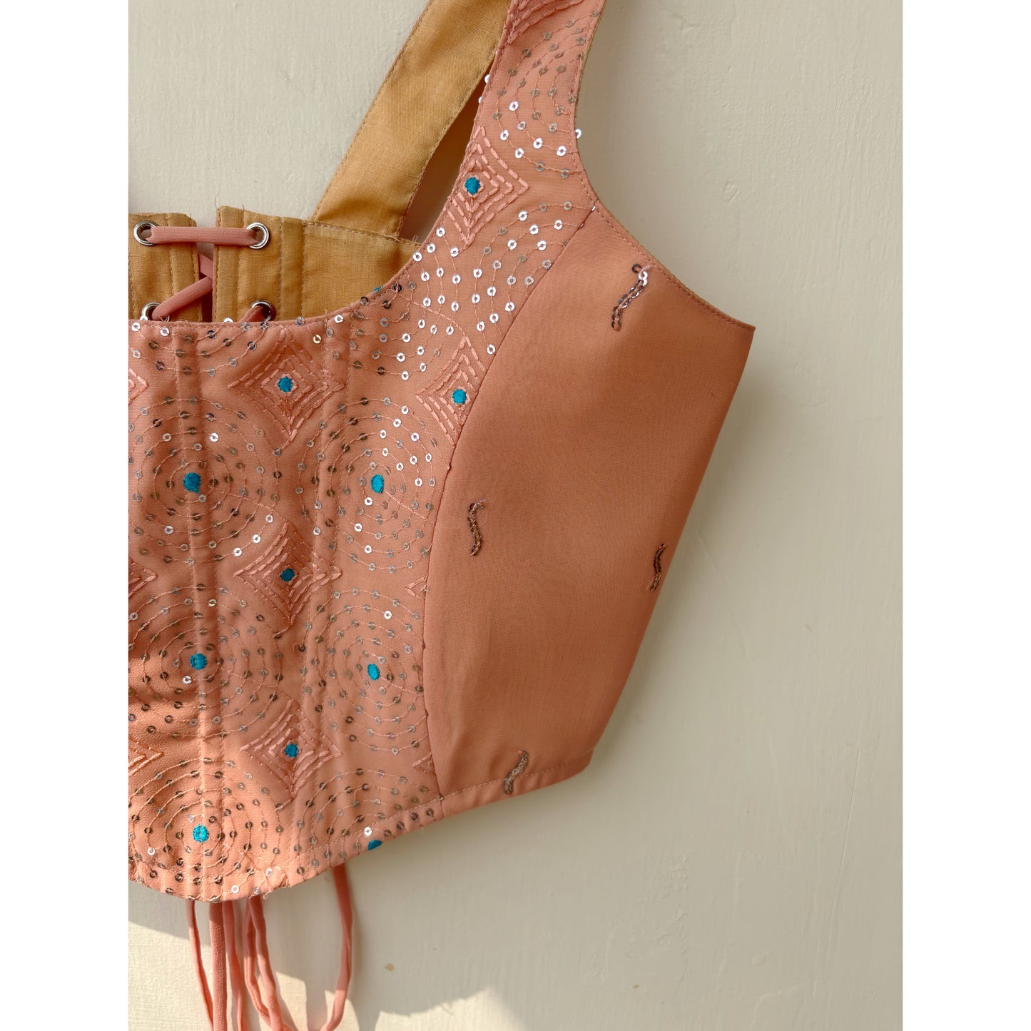 Peach sequins with blue thread work corset