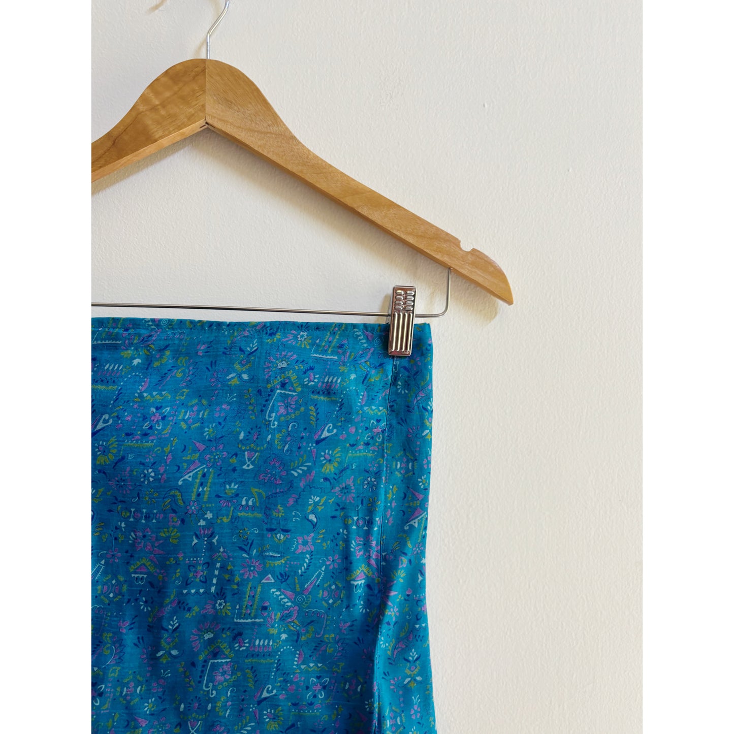 Artsy blue smocked back top