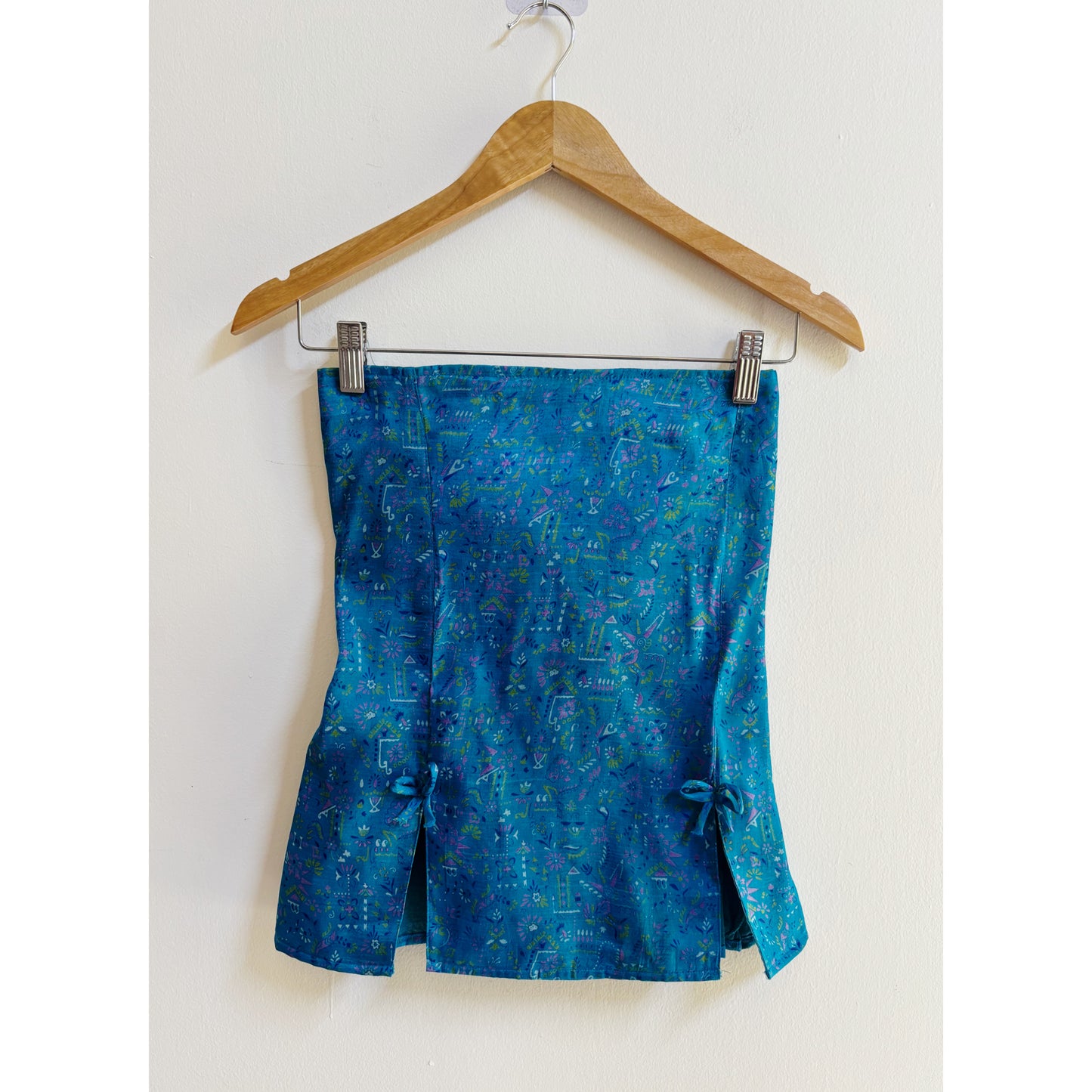 Artsy blue smocked back top