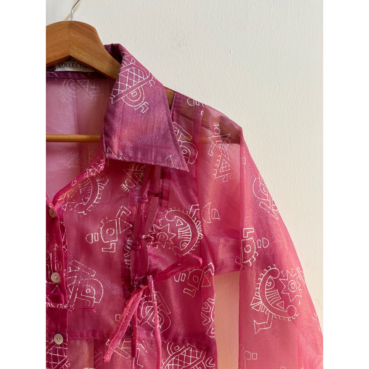 Tribal motif pink shirt