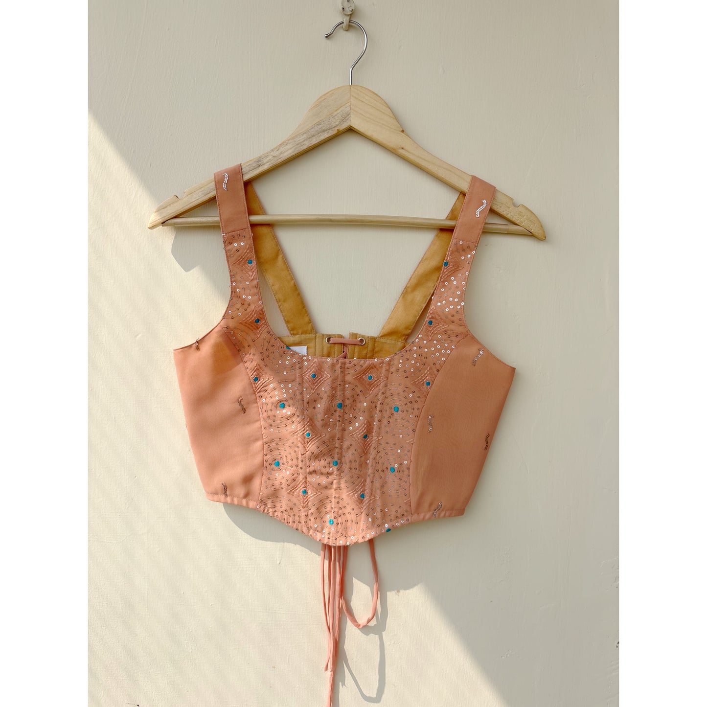 Peach sequins with blue thread work corset