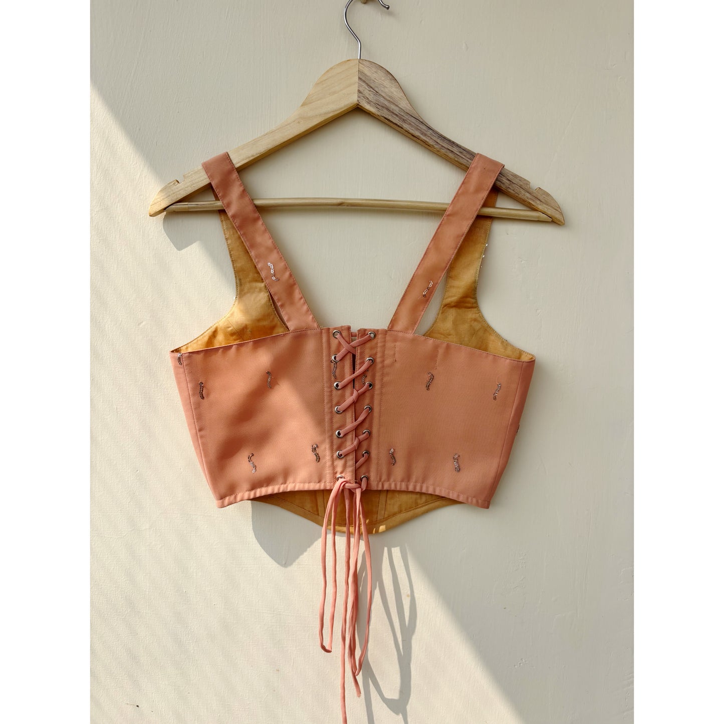 Peach sequins with blue thread work corset