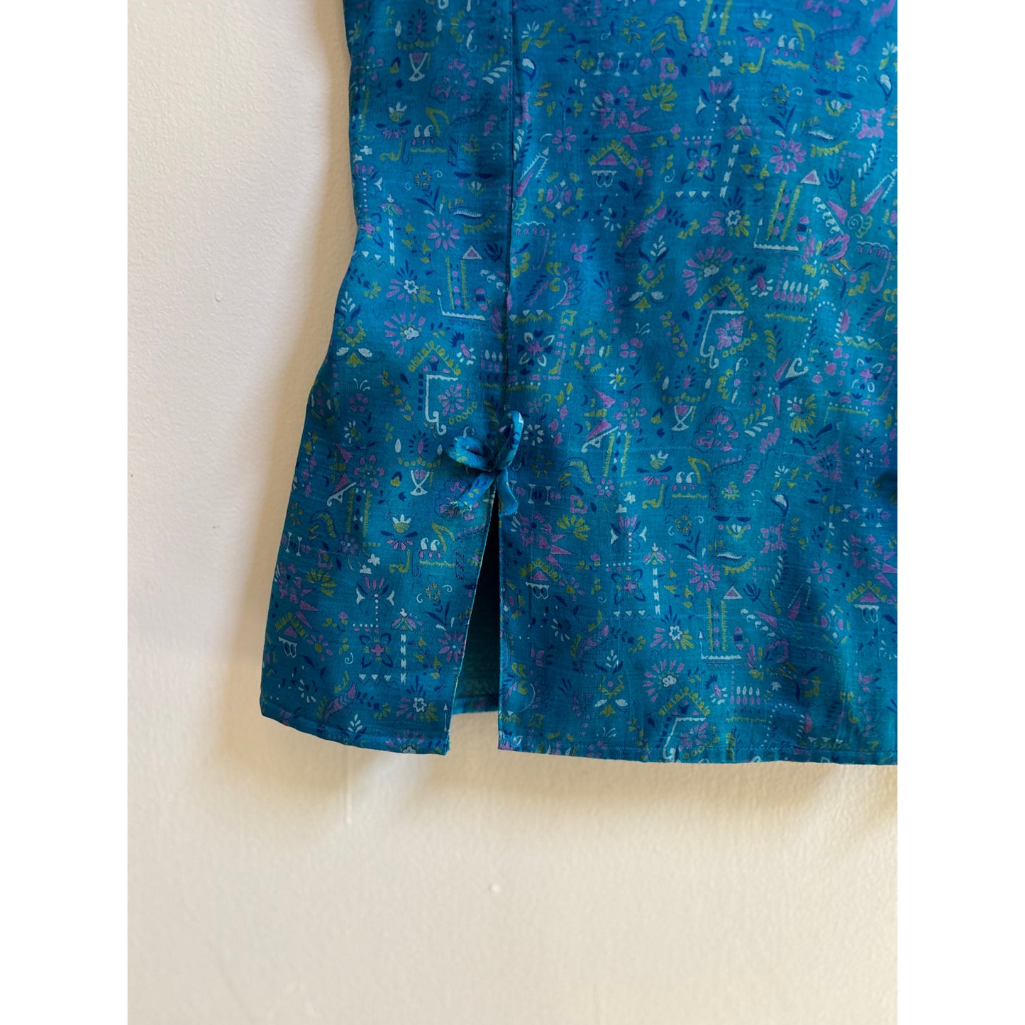 Artsy blue smocked back top